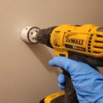 drills on the wall for asbestos sampling